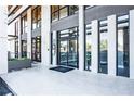 Modern building entrance with sleek black frames and glass doors at 2285 Peachtree Ne Rd # 604, Atlanta, GA 30309
