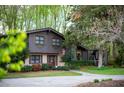 Lovely two-story home with a brick facade, mature trees and charming curb appeal at 1039 Smyrna Rd Sw, Conyers, GA 30094