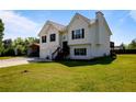 Well-maintained two-story home with a spacious green lawn, a two-car garage, and a covered parking area at 195 Woodbridge Dr, Dallas, GA 30157