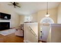 Bright living room featuring vaulted ceilings, fireplace, and hardwood floors, creating a cozy and inviting atmosphere at 195 Woodbridge Dr, Dallas, GA 30157