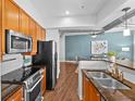 Modern kitchen features stainless steel appliances, granite countertops, and ample cabinet space at 1029 Piedmont Ne Ave # 102, Atlanta, GA 30309