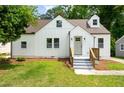 Attractive home featuring newly painted siding, tidy landscaping and inviting front entrance at 1282 Eastridge Sw Rd, Atlanta, GA 30311