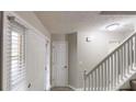 Hallway with a staircase, closet and interior doors at 2740 Ashley Downs Ln, Atlanta, GA 30349