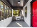 Relaxing screened porch with comfortable seating and ample natural light at 1340 Hawthorne Se Ave, Smyrna, GA 30080