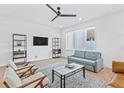 Bright living room with hardwood floors, ceiling fan, and neutral-toned furniture at 2424 Memorial Se Dr # 3, Atlanta, GA 30317