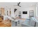 Open concept living room with hardwood floors, ceiling fan, and stylish furnishings at 2424 Memorial Se Dr # 3, Atlanta, GA 30317
