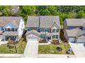 Aerial view of a well-maintained two-story home with a lush green lawn and manicured landscaping at 2770 Westgate Park Dr, Loganville, GA 30052