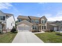 Charming two-story home featuring a two-car garage, manicured lawn, and inviting front porch at 2770 Westgate Park Dr, Loganville, GA 30052