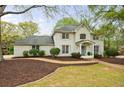 Beautiful two-story home with a brick facade, well-maintained landscaping, and inviting entryway at 640 Saddle Ridge Trce, Roswell, GA 30076