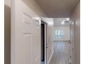 Inviting entryway showcasing a view into the open living area with hardwood floors and a ceiling fan at 3979 Sharon Spgs, Powder Springs, GA 30127