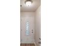 Hallway featuring elegant front door with decorative glass and neutral paint at 3979 Sharon Spgs, Powder Springs, GA 30127