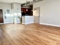 Spacious living room featuring wood floors and stainless steel appliances at 502 Pryor St # 207, Atlanta, GA 30312