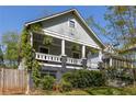 Charming home with a welcoming front porch framed by lush landscaping in a desirable location at 136 Flora Ne Ave, Atlanta, GA 30307