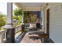 Inviting front porch with swing and decorative accents, offering a cozy outdoor space at 136 Flora Ne Ave, Atlanta, GA 30307