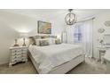 Serene main bedroom with soft carpet, decorative pillows, and natural light at 6820 Glenridge Dr # C, Sandy Springs, GA 30328