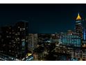 Stunning night view of the city skyline with illuminated buildings, creating a vibrant urban ambiance at 860 Peachtree Ne St # 2716, Atlanta, GA 30308