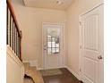 Inviting entryway featuring stairs, tile floor and a door with decorative glass at 4354 Favored Way, Union City, GA 30291