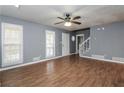 Spacious living room with hardwood floors, ceiling fan and natural light at 495 Stratford Dr, Douglasville, GA 30134