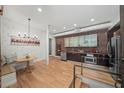 Modern kitchen features stainless steel appliances, brick accents, and stylish lighting at 65 Peachtree Memorial Nw Dr # 5, Atlanta, GA 30309