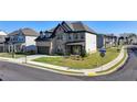 Charming two-story home with a two-car garage, covered front porch, and pristine landscaping in a Gathering-friendly neighborhood at 4409 Encore Park Lane, Duluth, GA 30097