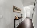 Inviting entryway features dark hardwood floors and a console table, creating a warm welcome at 216 Ellis Ln, Woodstock, GA 30189