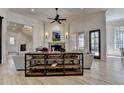 Bright living room showcasing a fireplace, hardwood floors, and large windows for natural light at 4505 Whitestone Way, Suwanee, GA 30024