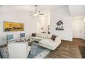 Bright and airy living room featuring modern furniture, hardwood floors and stylish decor at 1195 Awenasa Dr, Villa Rica, GA 30180