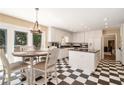 Bright kitchen with black-and-white checkered floor, an island and stainless steel appliances at 1935 Northbrooke Ln, Atlanta, GA 30338