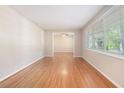 Bright living room featuring hardwood floors and large windows at 2480 Warwick Ne Cir, Atlanta, GA 30345
