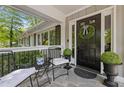 Cozy front porch with comfortable seating and elegant decor, perfect for enjoying the outdoors at 2574 Warwick Dr, Marietta, GA 30062