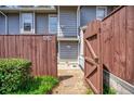 Charming front entrance with a wooden gate, stone pathway, and the house number on display at 4992 Meadow Ln, Marietta, GA 30068