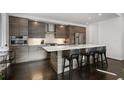 Sleek kitchen with dark wood cabinets, stainless steel appliances, and a large island at 504 Rankin Ne St # 4, Atlanta, GA 30308