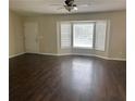 Open living room featuring hardwood floors and a bright bay window at 126 Amberwood Ln, Euharlee, GA 30145