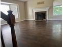 Living room showcases a fireplace and hardwood floors at 126 Amberwood Ln, Euharlee, GA 30145