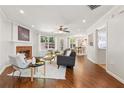 Bright living room with a fireplace, hardwood floors, and an open layout at 1433 Chardin Dr, Marietta, GA 30062