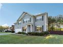 Beautiful two-story home featuring a manicured lawn, charming landscaping, and a spacious two-car garage at 4528 Venus Sw Ct, Powder Springs, GA 30127