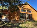 Stunning wood exterior with large windows and attached covered patio at 639 Hall Station Rd, Kingston, GA 30145