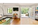 Cozy living room features hardwood floors, natural light, access to the backyard, and comfortable seating at 1355 Euclid Ne Ave # 15A, Atlanta, GA 30307