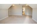 Spacious bonus room with neutral carpet and ample closet space, perfect for a playroom or home office at 2034 W Hampton Dr, Canton, GA 30115