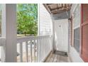 Inviting front porch of a charming unit, with a clear view of the unit number at 233 Cobblestone Trl, Avondale Estates, GA 30002