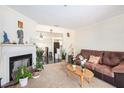 Comfortable living room featuring a fireplace and plush seating at 233 Cobblestone Trl, Avondale Estates, GA 30002