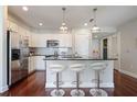 Well-lit kitchen featuring stainless steel appliances, dark counters and modern lighting at 200 River Vista Dr # 423, Atlanta, GA 30339