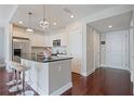 Bright kitchen with stainless steel appliances, modern lighting, and breakfast bar at 200 River Vista Dr # 423, Atlanta, GA 30339