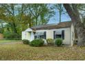 Charming one-story home with a well-kept lawn, showcasing its traditional design and inviting entrance at 3074 Delowe Dr, Atlanta, GA 30344