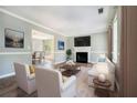 Bright living room features a fireplace, wood floors, and neutral wall paint at 3455 Kingsbrooke Way, Decatur, GA 30034