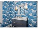 Chic powder room showcases blue wallpaper, stylish vanity, and modern lighting at 74 Academy St, Alpharetta, GA 30009