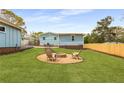 Large backyard with a fire pit and space for outdoor seating at 2374 Marion Cir, Decatur, GA 30032