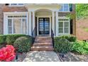 Inviting front porch with brick steps and lush landscaping at 3237 Birkdale Ave, Duluth, GA 30097