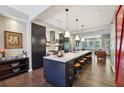 Modern kitchen with sleek black cabinetry, white countertops, and island seating at 1276 Edmund Ne Ln, Brookhaven, GA 30319