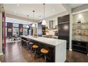 Contemporary kitchen with a long island, pendant lights, and adjacent dining area at 1276 Edmund Ne Ln, Brookhaven, GA 30319